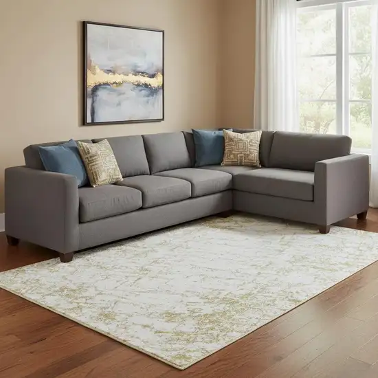 Gold And Ivory Abstract Washable Area Rug With UV Protection Photo 1