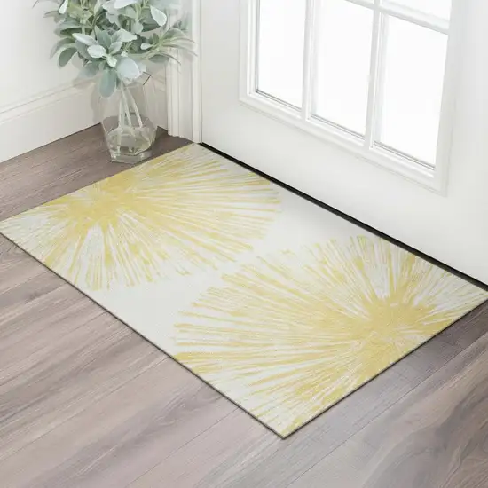 Gold And Ivory Abstract Washable Area Rug With UV Protection Photo 1