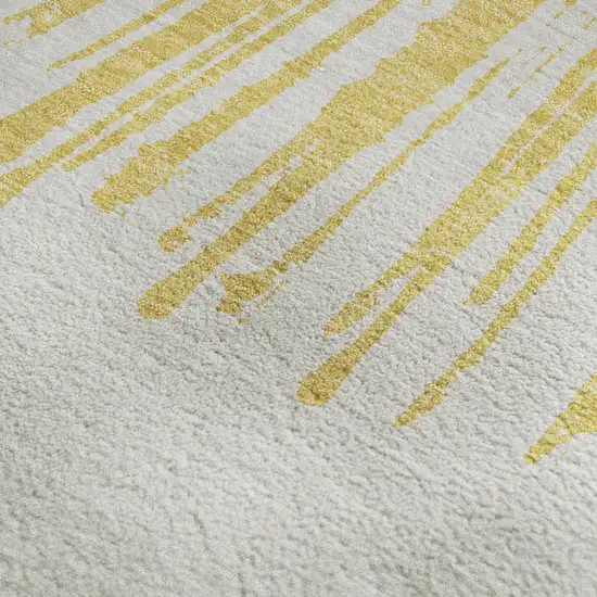 Gold And Ivory Abstract Washable Area Rug With UV Protection Photo 4