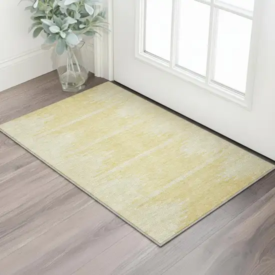 Gold And Ivory Abstract Washable Area Rug With UV Protection Photo 2