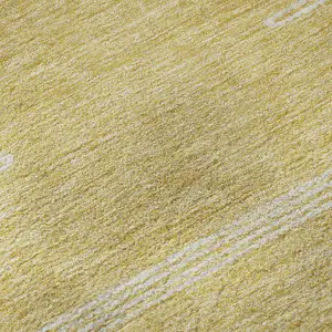 Photo of Gold And Ivory Abstract Washable Area Rug With UV Protection