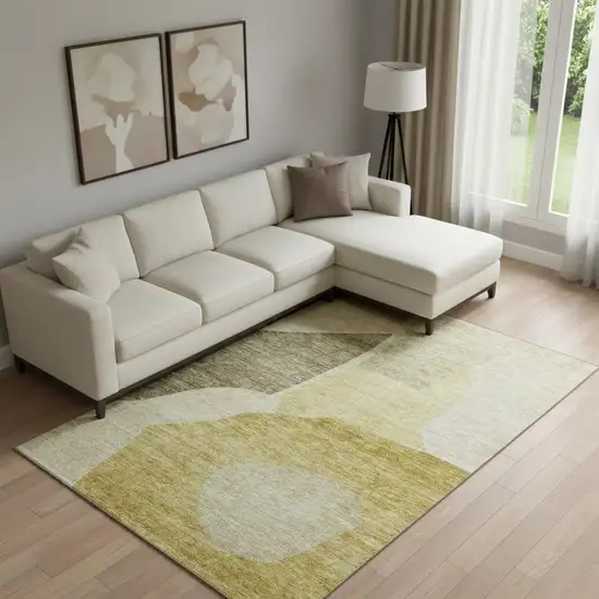 Gold And Ivory Abstract Washable Area Rug With UV Protection Photo 1