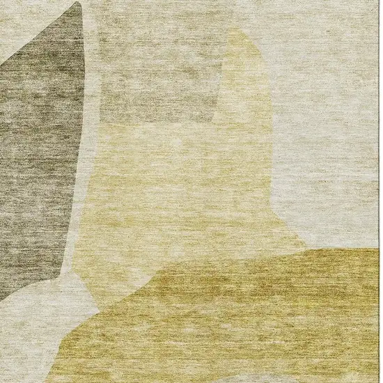Gold And Ivory Abstract Washable Area Rug With UV Protection Photo 3