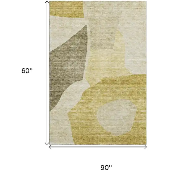 Gold And Ivory Abstract Washable Area Rug With UV Protection Photo 6