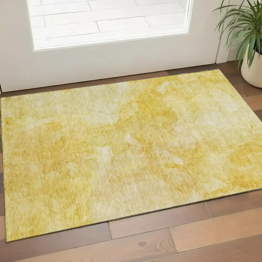 Gold And Ivory Abstract Washable Area Rug With UV Protection Photo 1