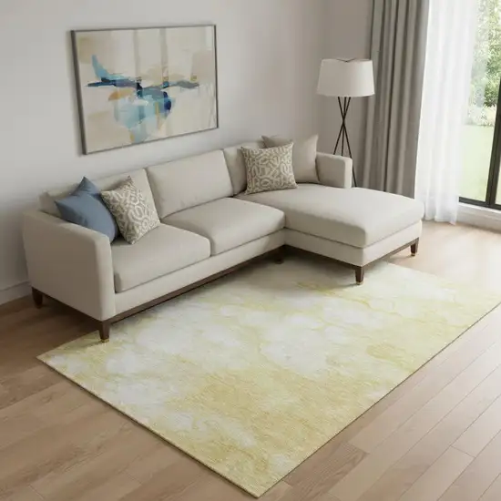 Gold And Ivory Abstract Washable Area Rug With UV Protection Photo 1