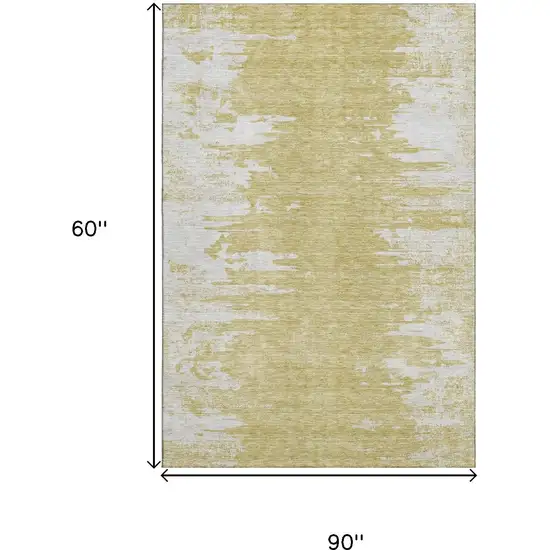 Gold And Ivory Abstract Washable Area Rug With UV Protection Photo 3