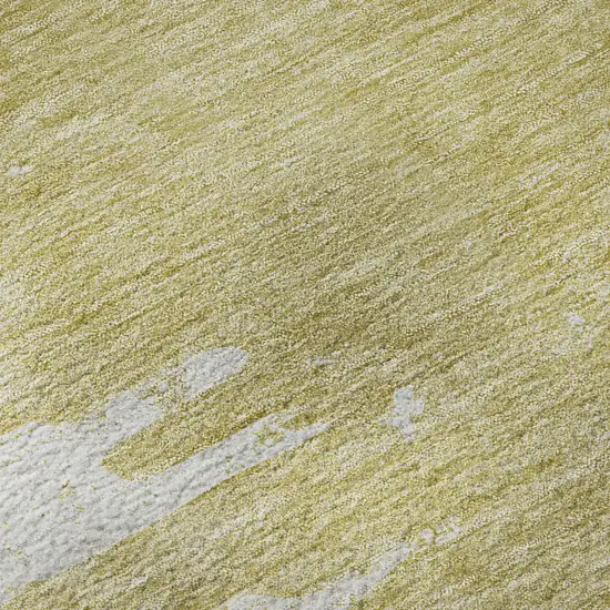 Gold And Ivory Abstract Washable Area Rug With UV Protection Photo 1
