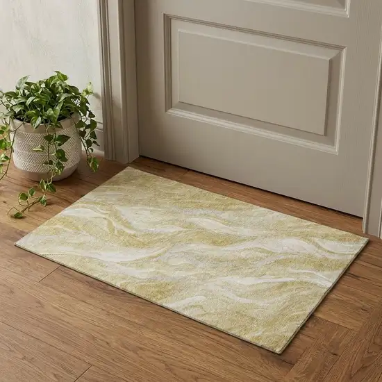 Gold And Ivory Abstract Washable Area Rug With UV Protection Photo 1