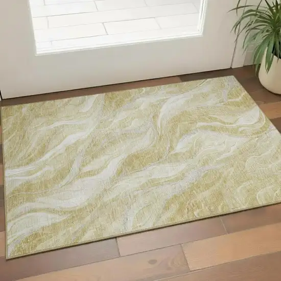 Gold And Ivory Abstract Washable Area Rug With UV Protection Photo 1