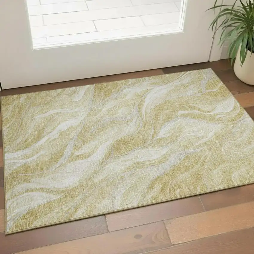 Gold And Ivory Abstract Washable Area Rug With UV Protection Photo 1