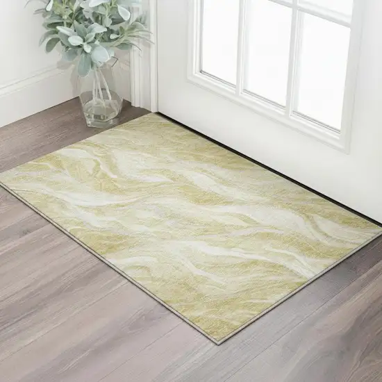 Gold And Ivory Abstract Washable Area Rug With UV Protection Photo 2