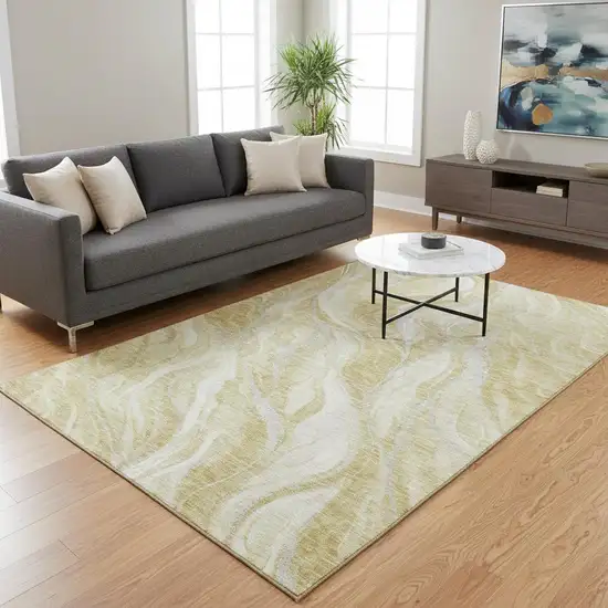 Gold And Ivory Abstract Washable Area Rug With UV Protection Photo 1