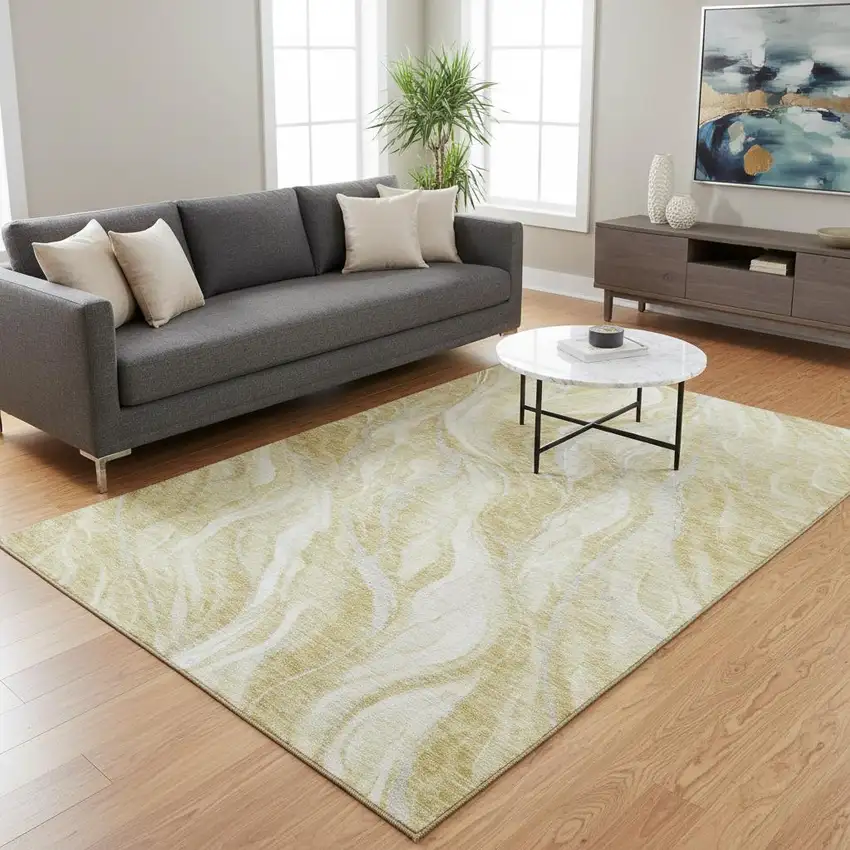 Gold And Ivory Abstract Washable Area Rug With UV Protection Photo 1