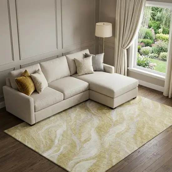 Gold And Ivory Abstract Washable Area Rug With UV Protection Photo 1