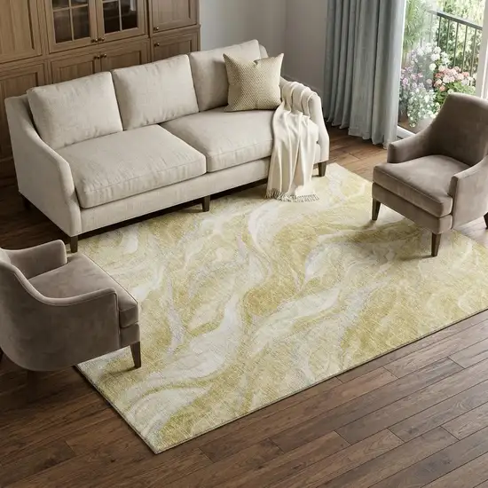 Gold And Ivory Abstract Washable Area Rug With UV Protection Photo 1