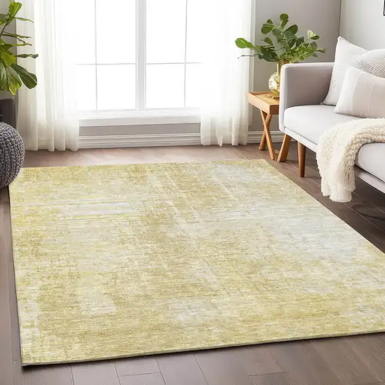 Gold And Ivory Abstract Washable Area Rug With UV Protection Photo 1