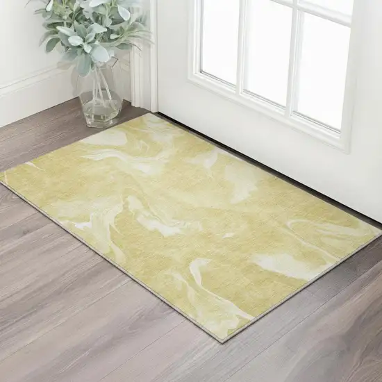 Gold And Ivory Abstract Washable Area Rug With UV Protection Photo 2