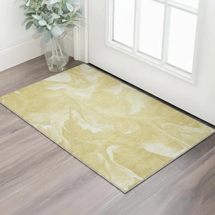 Gold And Ivory Abstract Washable Area Rug With UV Protection Photo 2