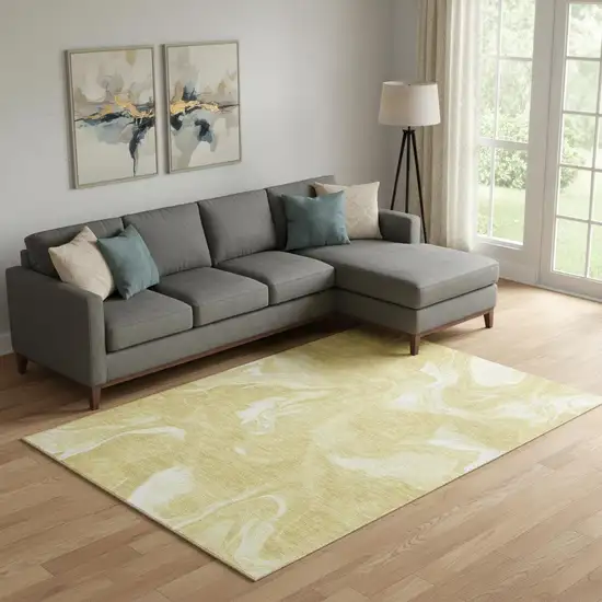 Gold And Ivory Abstract Washable Area Rug With UV Protection Photo 1