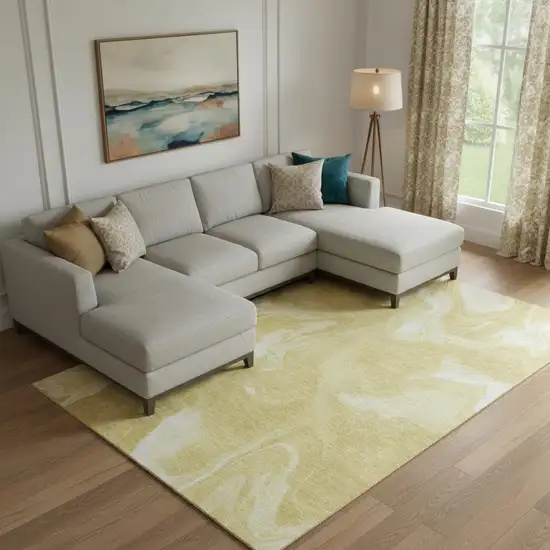 Gold And Ivory Abstract Washable Area Rug With UV Protection Photo 1