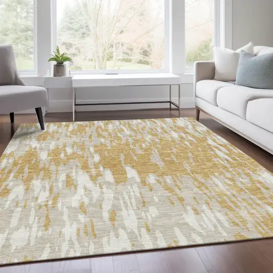 Gold And Ivory Abstract Washable Area Rug With UV Protection Photo 4