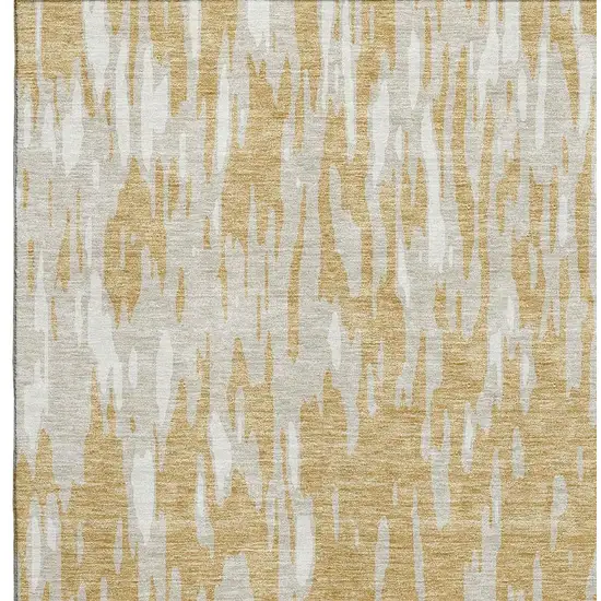 Gold And Ivory Abstract Washable Area Rug With UV Protection Photo 3