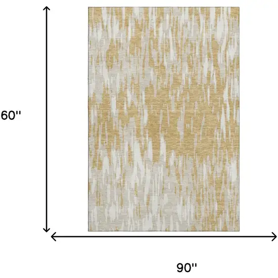 Gold And Ivory Abstract Washable Area Rug With UV Protection Photo 8