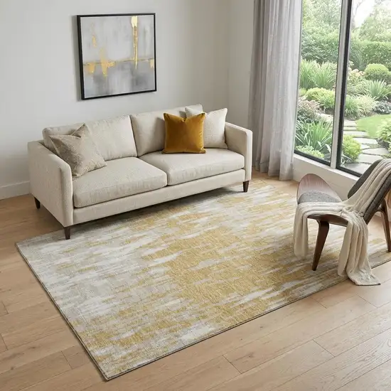 Gold And Ivory Abstract Washable Area Rug With UV Protection Photo 1