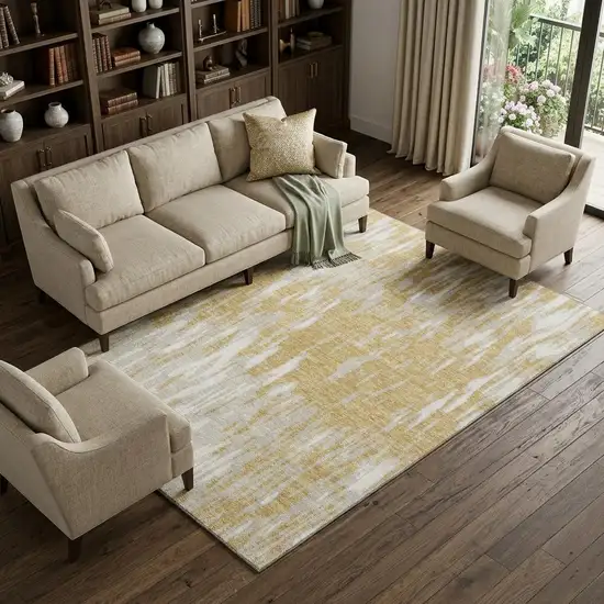 Gold And Ivory Abstract Washable Area Rug With UV Protection Photo 1