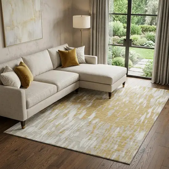 Gold And Ivory Abstract Washable Area Rug With UV Protection Photo 1