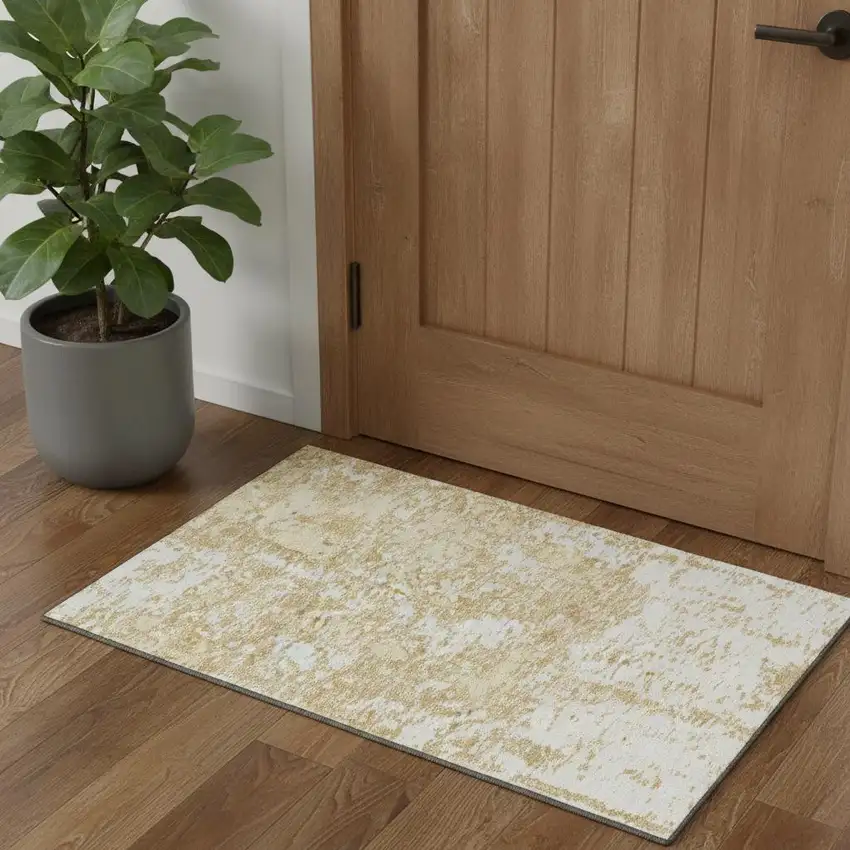 Gold And Ivory Abstract Washable Area Rug With UV Protection Photo 1