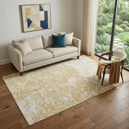 Gold And Ivory Abstract Washable Area Rug With UV Protection Photo 1