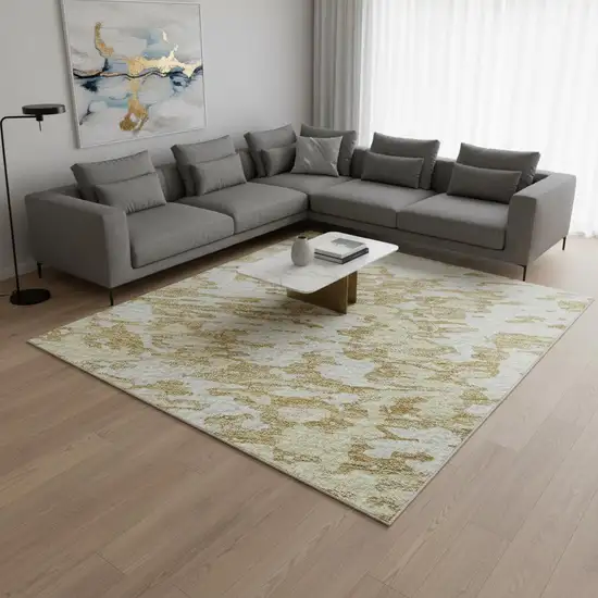 Gold And Ivory Abstract Washable Area Rug With UV Protection Photo 2