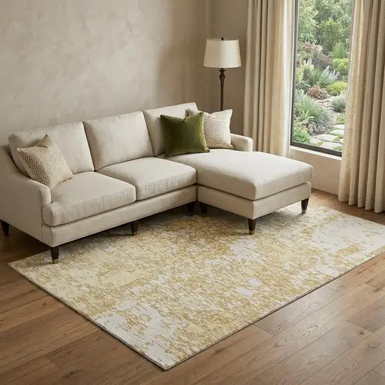 Gold And Ivory Abstract Washable Area Rug With UV Protection Photo 1