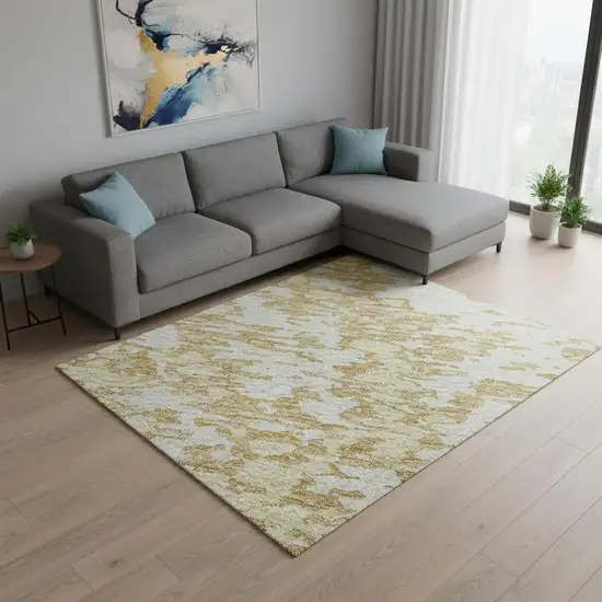 Gold And Ivory Abstract Washable Area Rug With UV Protection Photo 2