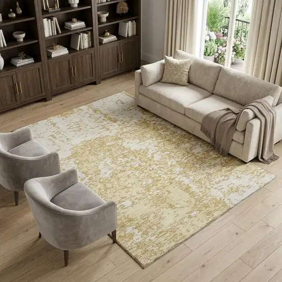 Gold And Ivory Abstract Washable Area Rug With UV Protection Photo 1