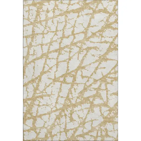 Gold And Ivory Abstract Washable Area Rug With UV Protection Photo 1