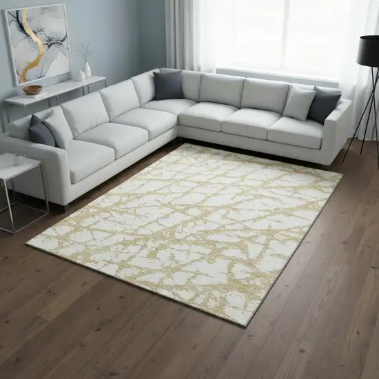 Gold And Ivory Abstract Washable Area Rug With UV Protection Photo 2