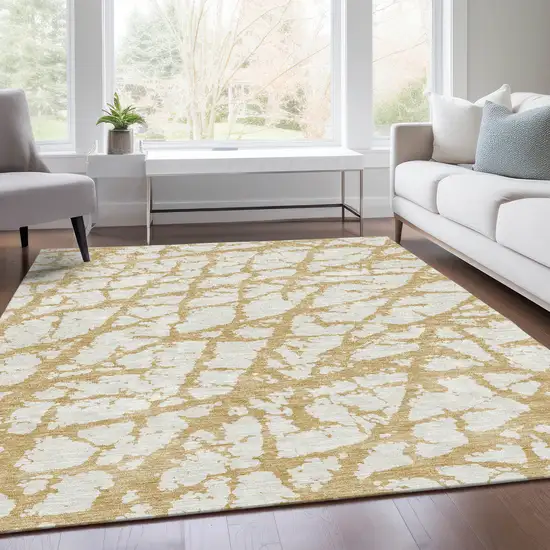 Gold And Ivory Abstract Washable Area Rug With UV Protection Photo 5