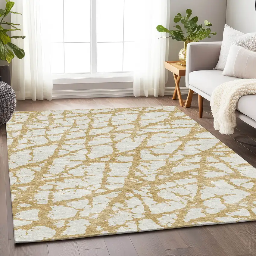 Gold And Ivory Abstract Washable Area Rug With UV Protection Photo 4