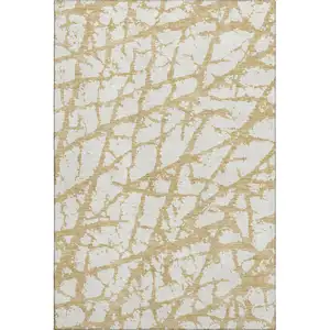 Photo of Gold And Ivory Abstract Washable Area Rug With UV Protection