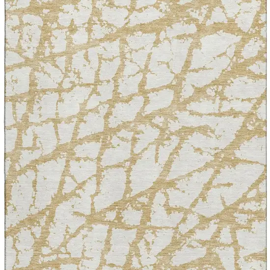 Gold And Ivory Abstract Washable Area Rug With UV Protection Photo 2