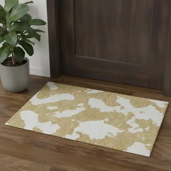 Gold And Ivory Abstract Washable Area Rug With UV Protection Photo 1