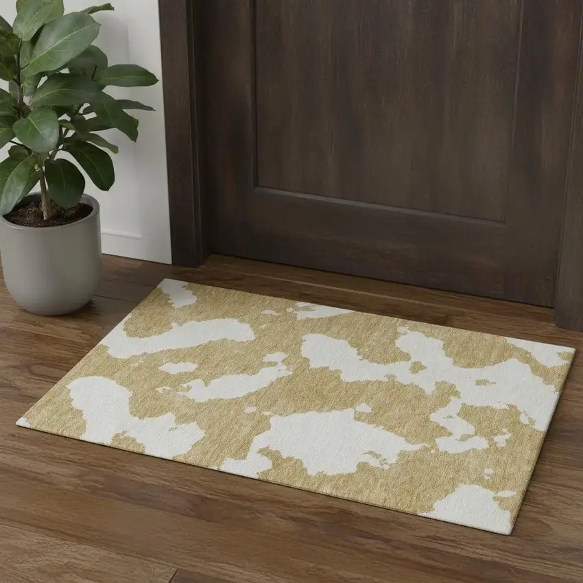 Gold And Ivory Abstract Washable Area Rug With UV Protection Photo 1