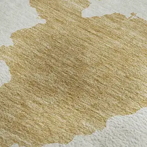 Photo of Gold And Ivory Abstract Washable Area Rug With UV Protection