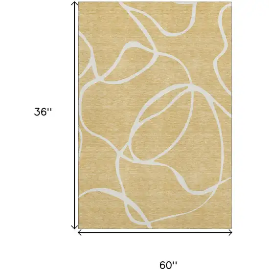 Gold And Ivory Abstract Washable Area Rug With UV Protection Photo 9