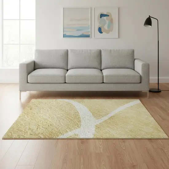 Gold And Ivory Abstract Washable Area Rug With UV Protection Photo 2