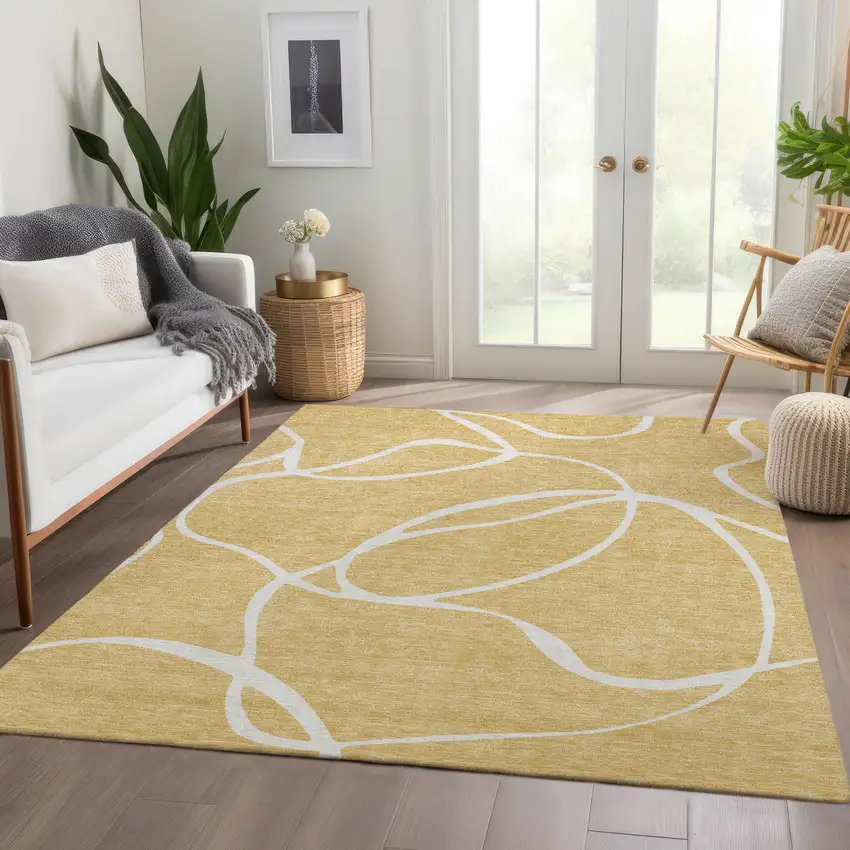 Gold And Ivory Abstract Washable Area Rug With UV Protection Photo 3