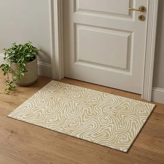 Gold And Ivory Abstract Washable Area Rug With UV Protection Photo 1